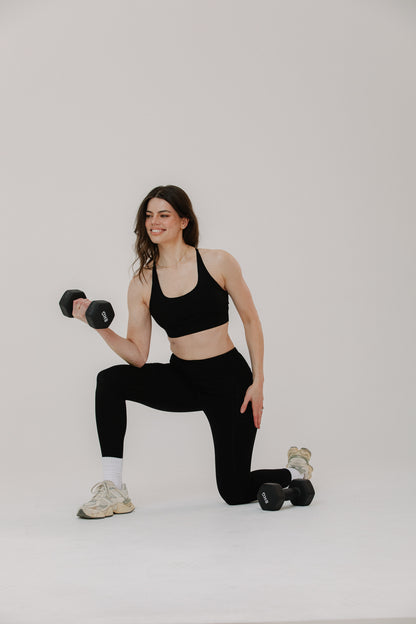 Tall Woman wearing cotton tall performance leggings in black with matching performance sports bra, front view